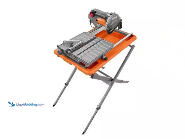 Lot 49-1570215 - RIDGID 9-Amp 7 in. Blade Corded Wet Tile Saw with Stand, Model # R4031S, Slightly used, Works.   Ref...