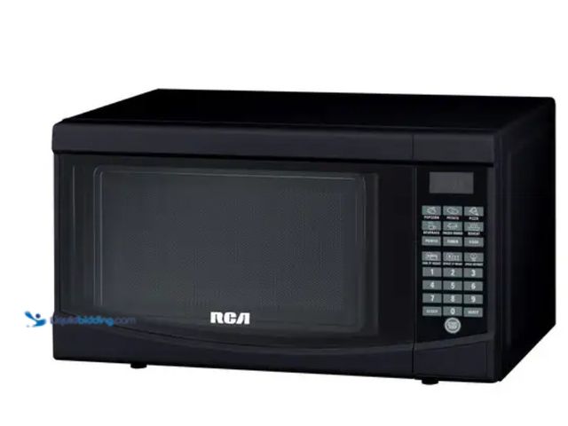 Lot 49-5538973 - Curtis - 0.7 Cu. Ft. Compact Microwave - Black. Model: RMW733SKU: 11444947. Unused with attachments....