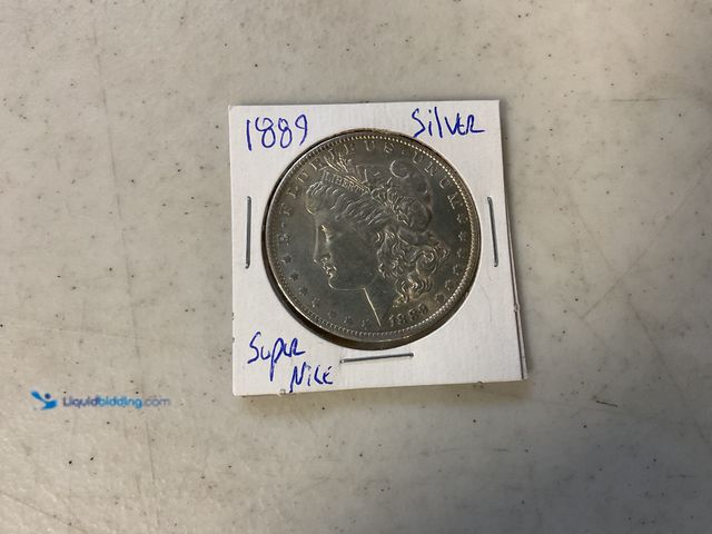 Lot 49-1811316 - 1889 MORGAN SILVER ONE DOLLAR COIN 90% SILVER