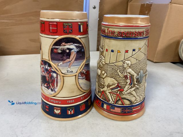 Lot 49-1505298 - COLLECTIBLE LOT OF 2 ANHEUSER-BUSCH COLLECTIBLE BEER STEINS BOTH OLYMPIC GAMES CALGARY AND USA NO OR...