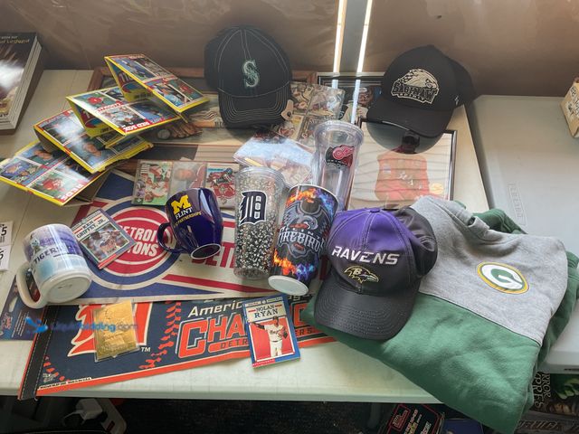 Lot 49-1804545 - TABLE LOT OF SPORTS MEMORABILIA.