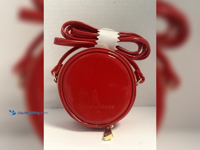 Lot 49-910380 - Marc Jacobs Round Crossbody Bag – Red Patent Style. Stylish Marc Jacobs round crossbody bag featurin...