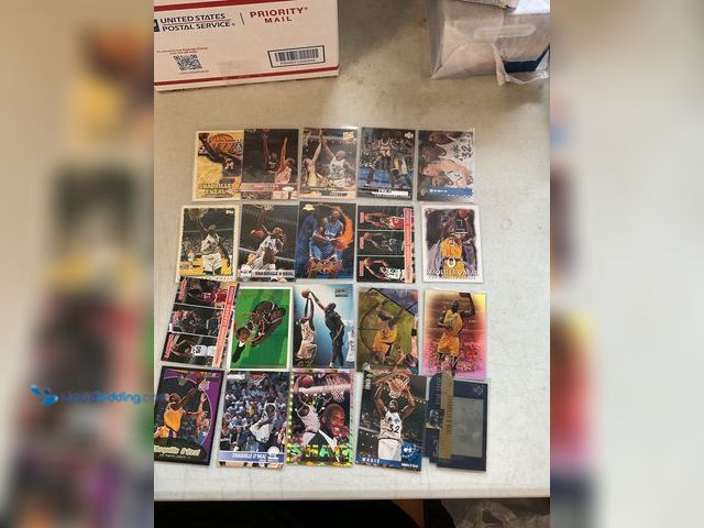 Lot 49-5341516 - LOT OF 20 SHAQUILLE ONEAL BASKETBALL CARDS FROM VARIOUS TYPES AND YEARS LOADED WITH GREAT CARDS SHOW...