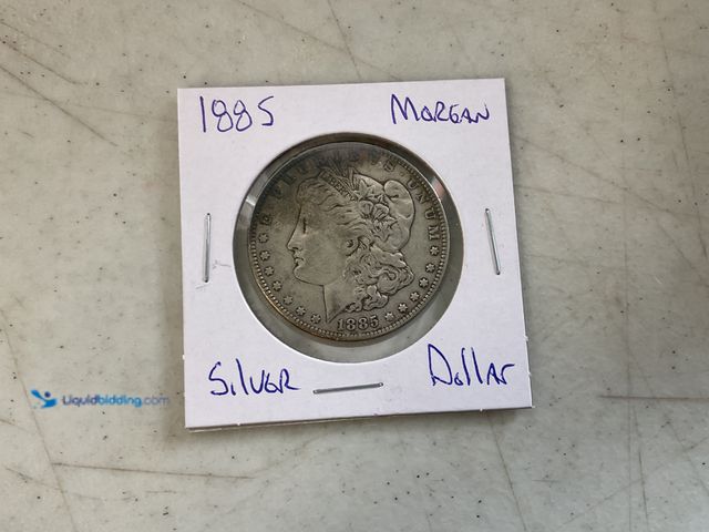 Lot 49-1505725 - 1885 MORGAN SILVER DOLLAR 90% SILVER #COINS0122