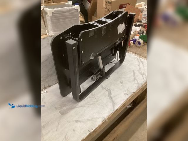 Lot 49-5483479 - Black Rising Desktop with charging port, 3ft x 2ft. Used, scuffs/scratches