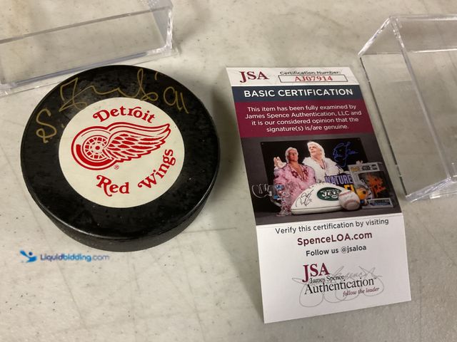 Lot 49-1505642 - COLLECTIBLE NICE DETROIT RED WINGS SUPERSTAR SERGEI FEDOROV AUTOGRAPHED HOCKEY PUCK WITH JSA COA #CO...