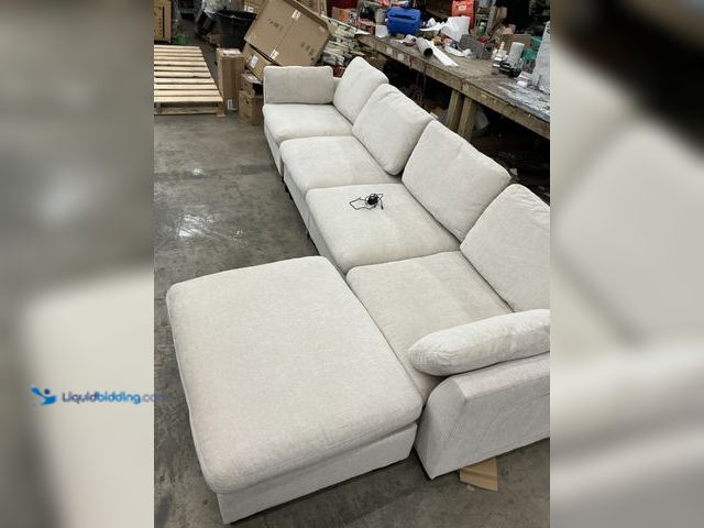 Lot 49-5546113 - 4 Tier Gray Couch W/ Ottoman (charging port included) (feet loose) Unused