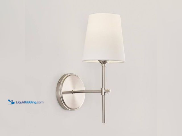 Lot 49-3566022 - Generation Lighting
Baker 5.5 in. 1-Light Brushed Nickel Wall Sconce With White Linen Fabric Shade....