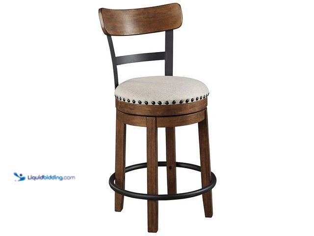 Lot 49-3637900 - Ashley Valebeck 360° Swivel Nailhead Bar Stool, Brown Wood, Padded Upholstered Seat, Model # D546-42...