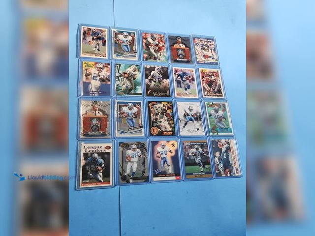 Lot 49-1817781 - 20- COLLECTIBLE BARRY SANDERS FOOTBALL CARDS. VARIOUS BRANDS AND YEARS PRODUCED. INCLUDES WILD CARD ...