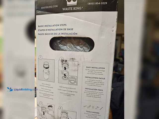 Lot 49-1984008 - New Waste King 1/3 hp Under sink garbage disposal  1/3 hp Waste King electric garbage disposal.