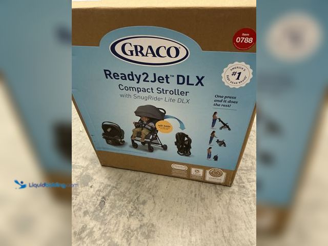 Lot 49-3564747 - Graco Ready2Jet DLX Travel System - Inkstone, New.