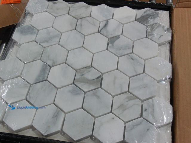 Lot 49-2024912 - Approx. (9) Sq. Ft. of  MSI Calacatta Cressa 12.38 x 12.38 in. Honed Hexagon Mosaic Tile with Distin...