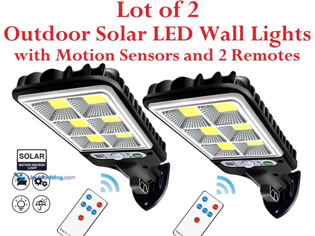 Lot 49-3435051 - Lot of 2 Outdoor Solar LED Wall Lights with Motion Sensors and 2 Remotes - NEW - 8.9" x 3.3"  Featur...