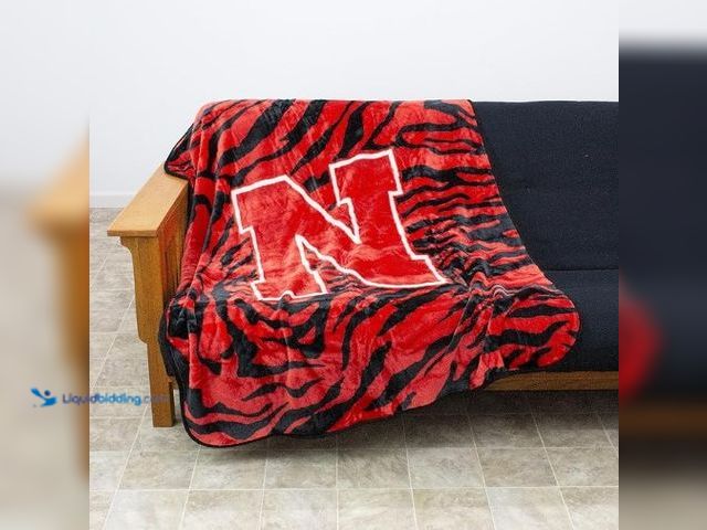 Lot 49-1556631 - College Covers Nebraska Cornhuskers Raschel Throw Blanket, 60 in by 50 in Model #B0170AYAMG, Unused ...