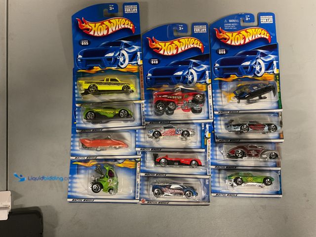 Lot 49-1811368 - COLLECTIBLE 12 HOT WHEEL CARS FROM VARIOUS YEARS AND TYPES