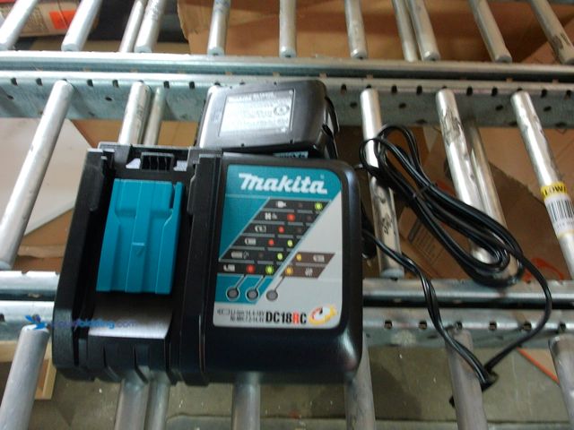 Lot 49-1548496 - Lot Containing 1 Makita 18V LXT Lithium-Ion Rapid Optimum Battery Charger, and 1 Makita 4.0ah 18v Ba...