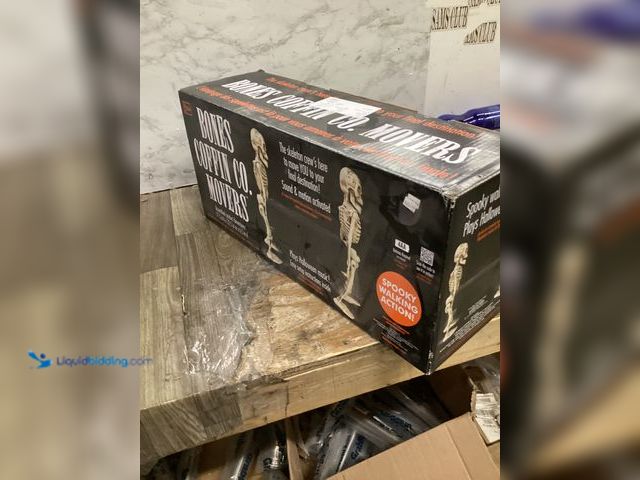 Lot 49-3517309 - Bones Coffin Co. Movers Animated Walking Skeletons Halloween Plays Music 17.5”. Unused.