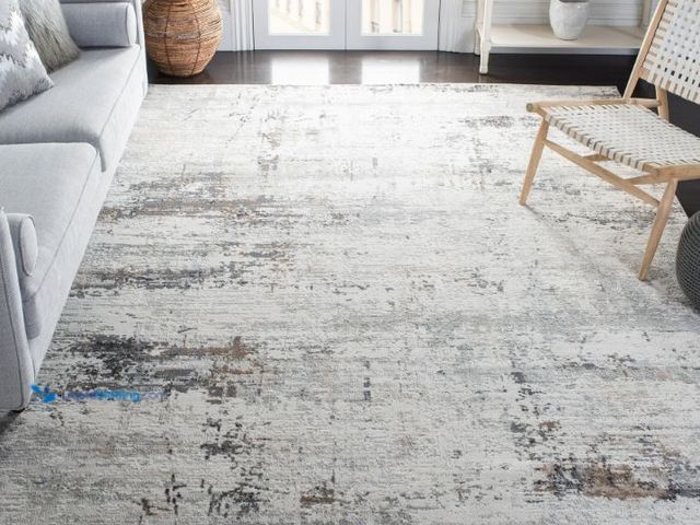 Lot 49-1623617 - SAFAVIEH Amelia Topher Abstract Area Rug, Ivory/Gray, 8' x 10', Model # 989025292, Slightly used.  R...