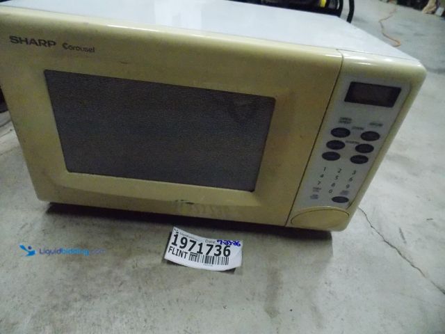 Lot 49-1971736 - Electric Sharp R-203FW Microwave Sharp Carousel Microwave Used In Rough Condition, Does Have Some Wa...