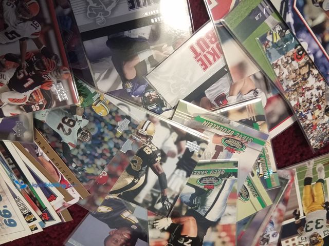 Lot 49-1801845 - COLLECTIBLE 50 comic books and 100 plus NFL cards