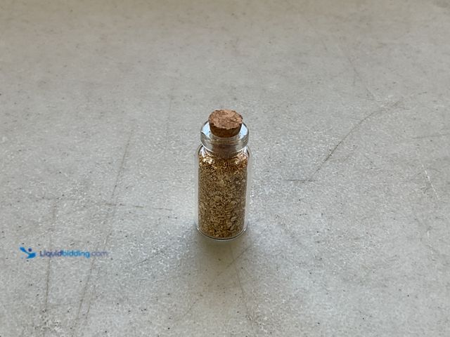 Lot 49-1971401 - RARE ONE INCH GLASS VILE OF PURE 24K GOLD FLAKES
