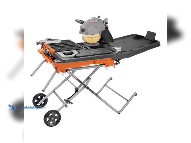 Lot 49-2004255 - RIDGID 15 Amp 10 in. Wet Tile Saw with Portable Stand, Model # R4093, MSRP $899, used, powers on, di...