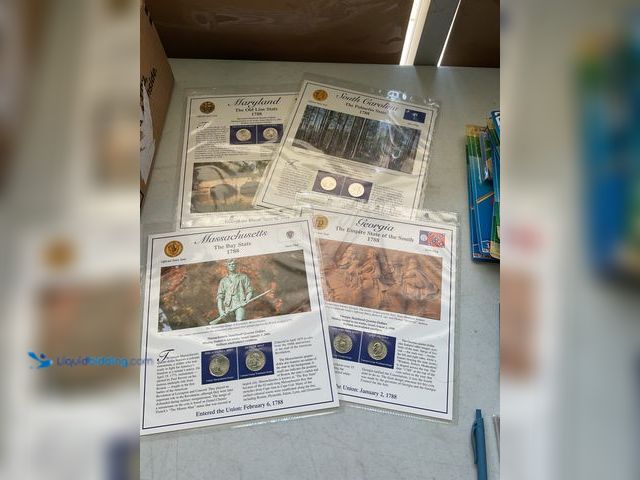Lot 49-3503803 - LOT OF 4 STATEHOOD QUARTER AND STAMP SETS INCLUDING MARYLAND, SOUTH CAROLINA, MASSACHUSETTS AND GEOR...