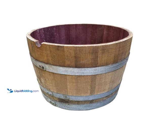 Lot 49-5538997 - Jack Daniels 27.5 in. Wood Oak Wine Barrel Planter. Model # OWBP. Used. Rusted and dirty.