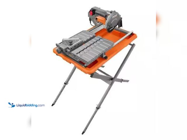 Lot 49-1569277 - RIDGID 9-Amp 7 in. Blade Corded Wet Tile Saw with Stand, Model # R4031S, Unused, Factory packed.  Re...
