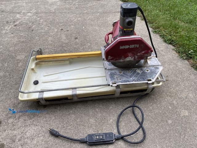 Lot 49-1975009 - MK tile saw 10" blade MK-1070 Electric Powered Tile Saw 24" rip cut, head tilts for 45 degree miter ...