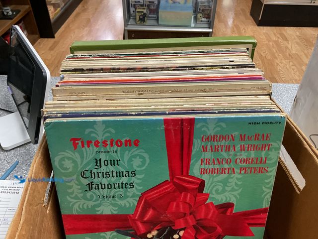 Lot 49-1816036 - COLLECTIBLE BOX FULL OF PRE-OWNED VINYL RECORDS FROM VARIOUS YEARS AND GENRES