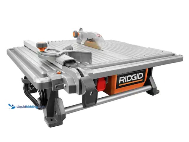 Lot 49-2000469 - RIDGID 6.5-Amp 7 in. Blade Corded Table Top Wet Tile Saw, Model # R4021, Slightly used, Has attachme...