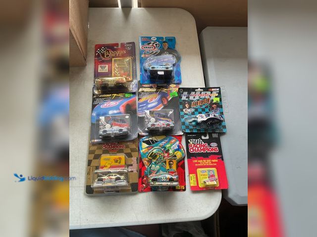 Lot 49-1977477 - Other LOT OF 8 VARIOUS NASCAR 1/64 SCALE DIECAST CARS NEW IN PACKAGES INCLUDING RACING CHAMPIONS, HO...