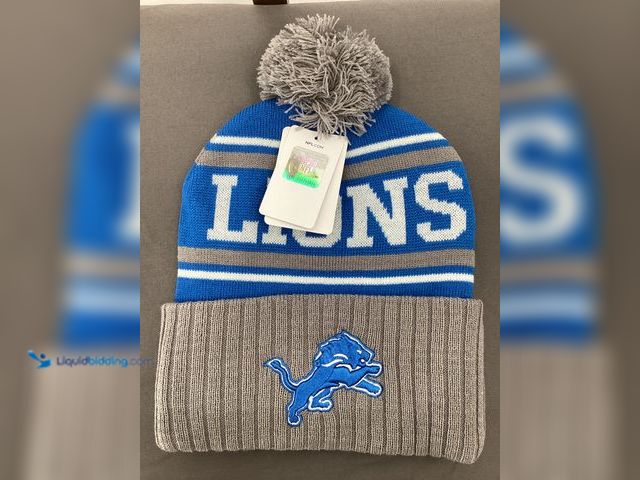 Lot 49-910839 - New Detroit Lions NFL Pom Beanie Hat - Gray and Blue with gray Pom Knit Cap.