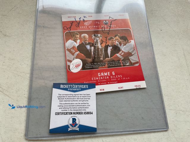 Lot 49-1801482 - RED WINGS HALL OF FAMERS TED LINDSAY AND GORDIE HOWE AUTOGRAPHED GAME TICKET WITH BECKETT COA