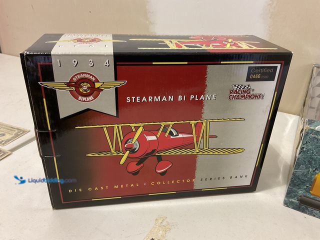 Lot 49-5515688 - Other RACING CHAMPIONS DIECAST METAL COLLECTOR SERIES BANK 1934 STEARMAN BIPLANE CERTIFIED 466/2500 ...