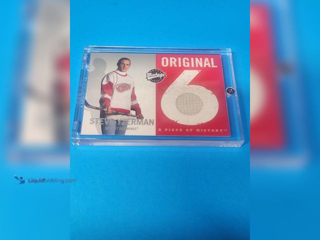 Lot 49-1988930 - 2000 UPPER DECK VINTAGE STEVE YZERMAN GAME JERSEY CARD.