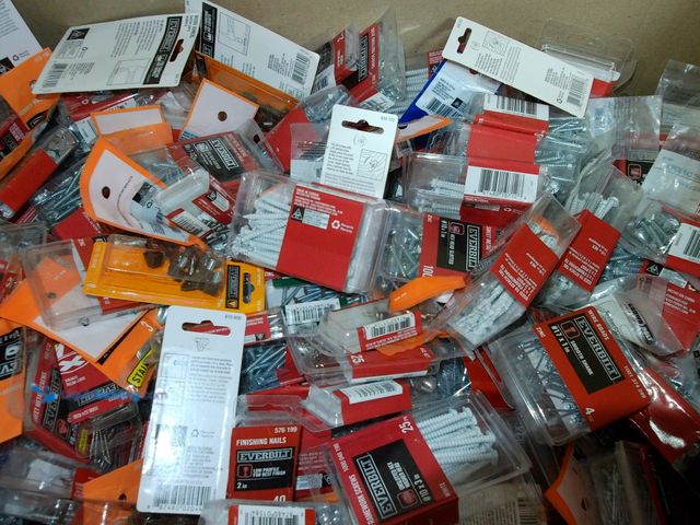 Lot 49-1550439 - Heavy box of miscellaneous fasteners and hardware, including screws, screw covers, finishing nails, ...