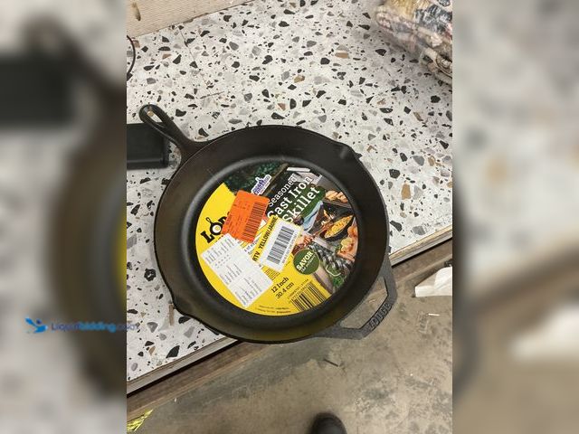 Lot 49-5485395 - Lodge Skillet Cast Iron 12 in. Black Pre-Seasoned Pour Spout Built-in Handles. Model #075536386201. ...