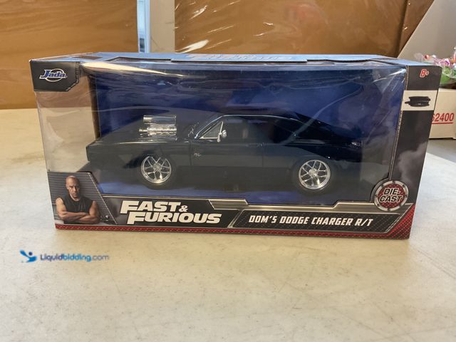 Lot 49-1814826 - COLLECTIBLE JADA FAST and FURIOUS DOM’S DODGE CHARGER R/T 1/24 SCALE DIECAST CAR IN ORIGINAL BOX #CO...