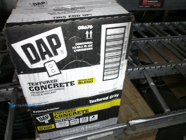 Lot 49-3464313 - (Lot Of 12) DAP 10.1 oz. Gray Textured Concrete Premium Elastomeric Filler and Sealant, Model# 08676...