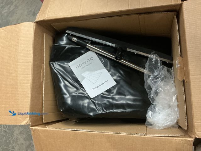 Lot 49-5463367 - Black Garage Floor Mat. Item is Used