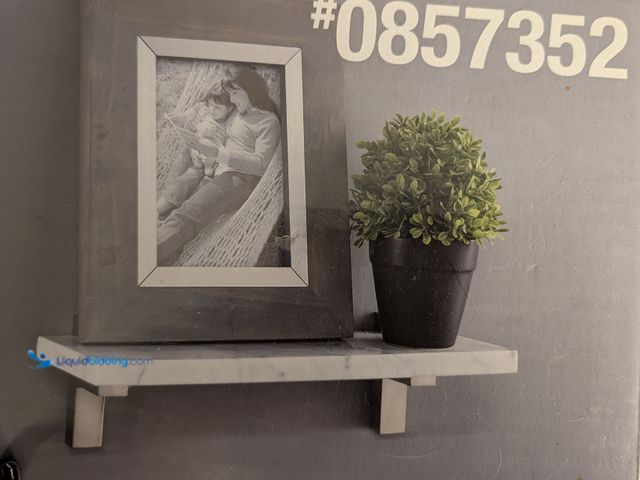 Lot 49-1814687 - One New Scott Living 0857352 Italian Carrara Marble wall shelf 14" Italian Carrara Marble Shelf with...