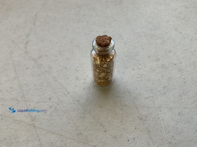 Lot 49-3503801 - RARE ONE INCH GLASS VILE OF PURE 24K GOLD FLAKES