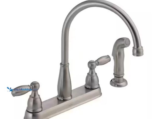 Lot 49-1518460 - Delta Foundations 2-Handle Standard Kitchen Faucet with Side Sprayer in Stainless Model # 21988LF-SS...