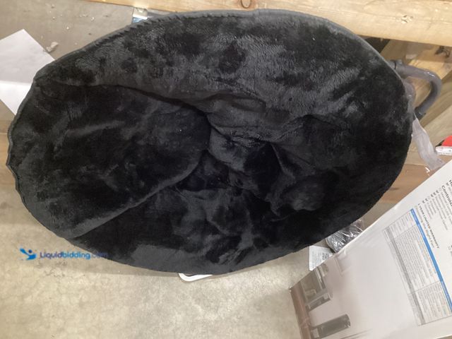 Lot 49-5542816 - Black Folding Saucer Char. Unused, Ripped on Chair