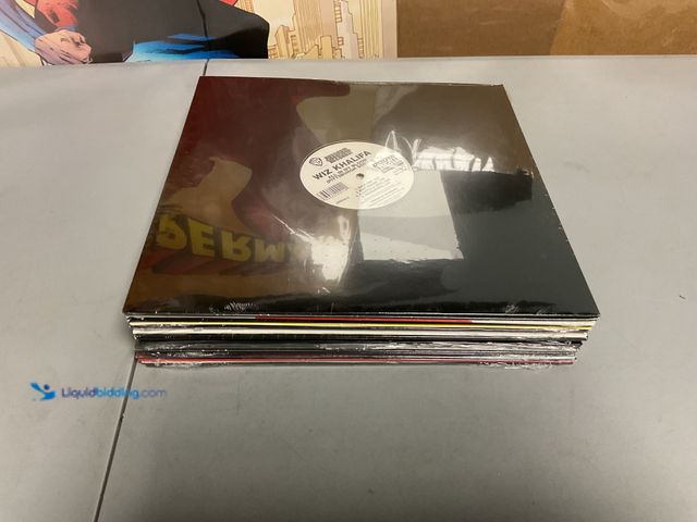 Lot 49-1505371 - COLLECTIBLE FACTORY SEALED LOT OF 20 VINYL RECORD VARIOUS GENRES AND TITLES INCLUDING WIZ KHALIFA, M...