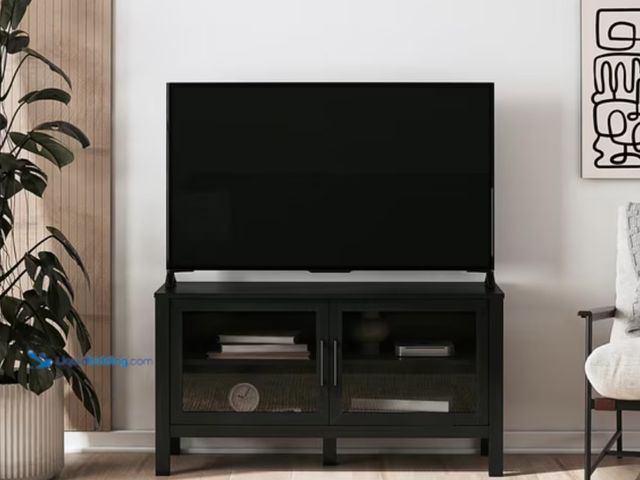 Lot 49-5541766 - Mainstays Glass Door TV Stand for TVs up to 55", Black Wood (hardware included) Unused