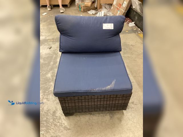 Lot 49-5414361 - Brown Wicker Patio Chair with Navy Blue Cushions, NO factory picture, Unused, one leg has damage.